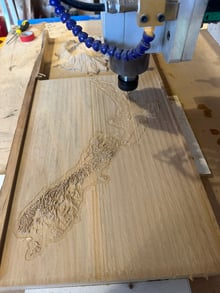 CNC machining a timber terrain map of New Zealand in the Design Eye workshop